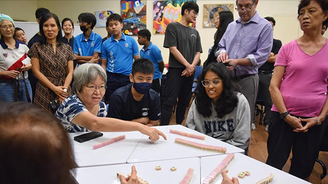 A game of Mahjong between young and old to fight ageism
